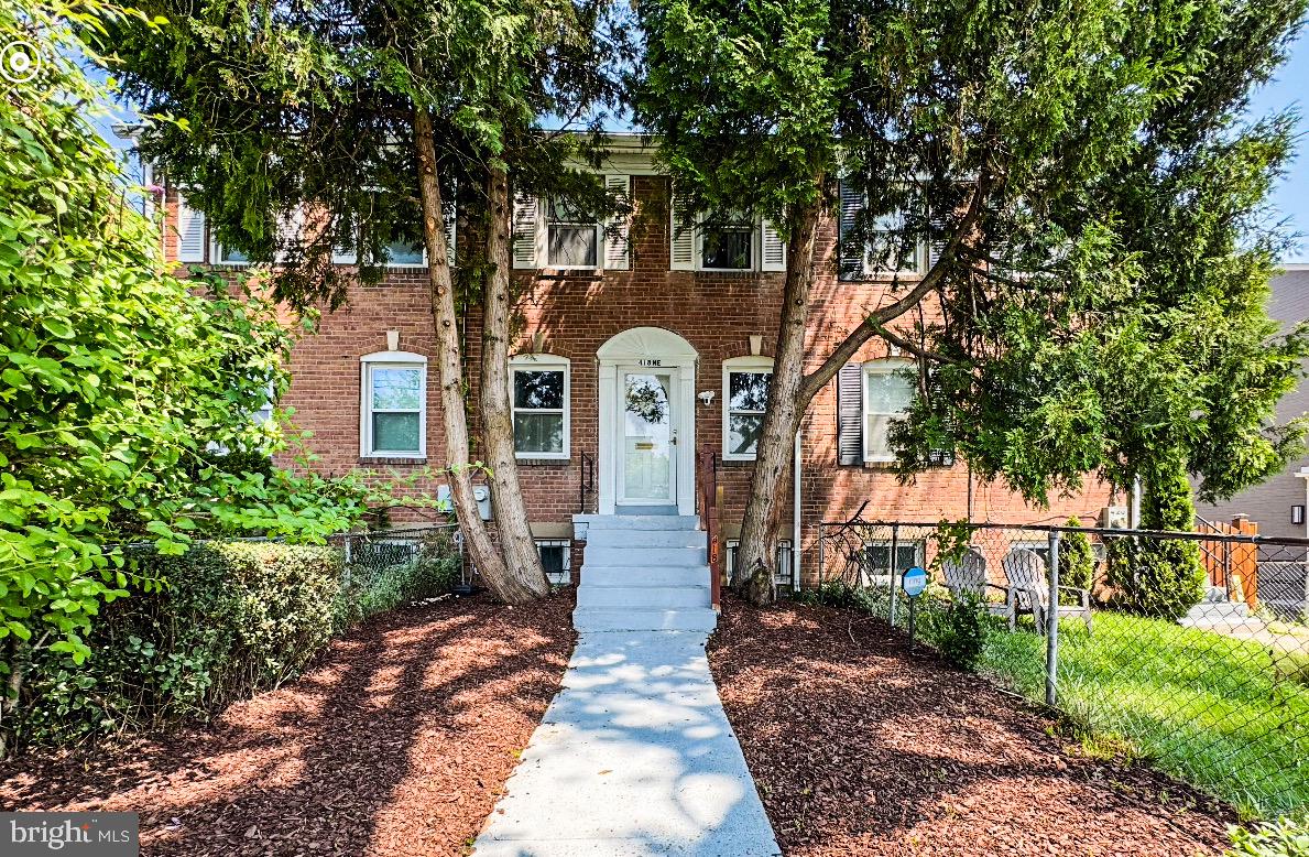 418 Peabody Street Northeast Washington, DC 20011 - Photo 20 of 20 a front view of a house with a garden