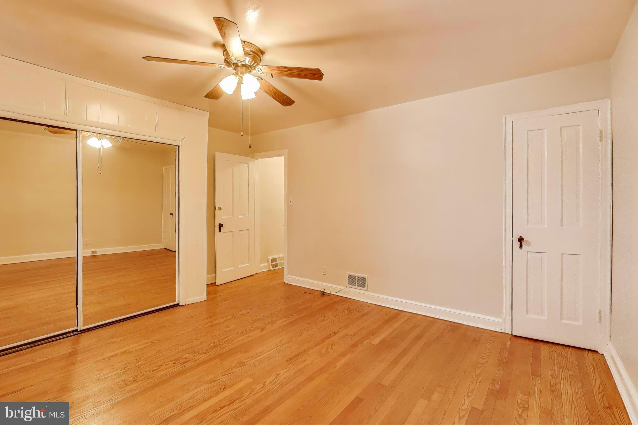 418 Peabody Street Northeast Washington, DC 20011 - Photo 7 of 20 wooden floor in an empty room