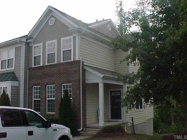 8443 Reedy Ridge Lane Raleigh, NC 27613 - Photo 1 of 10 a front view of a house with a yard