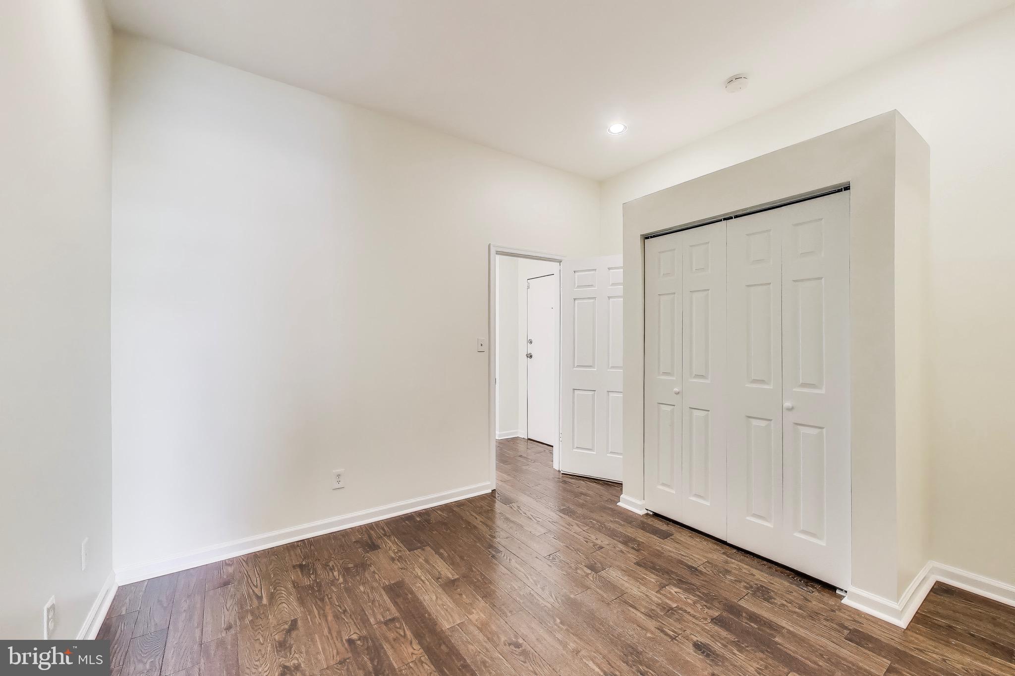 1625 S Street Northwest, Unit 1 Washington, DC 20009 - Photo 11 of 13 a view of an empty room with wooden floor