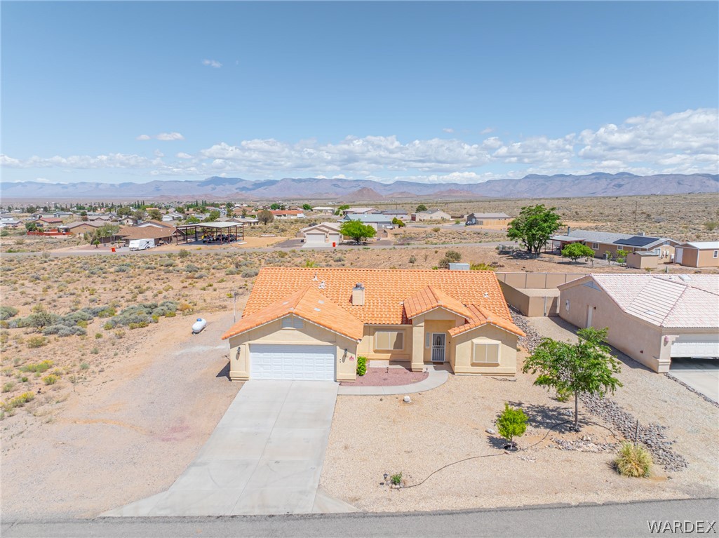 9332 Branded Road Kingman, AZ 86401 - Photo 22 of 44 an aerial view of residential houses with outdoor space