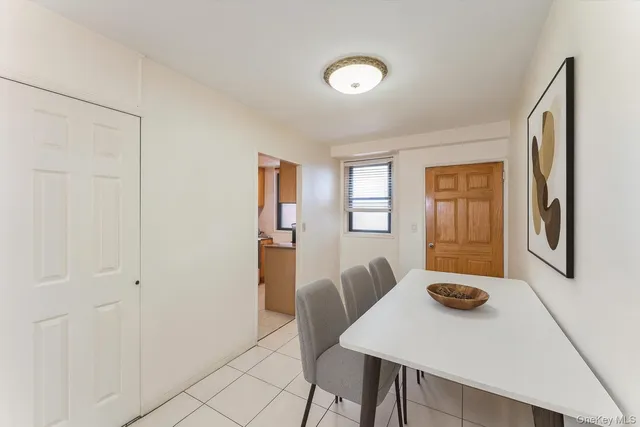 a view of a dining room with furniture and window