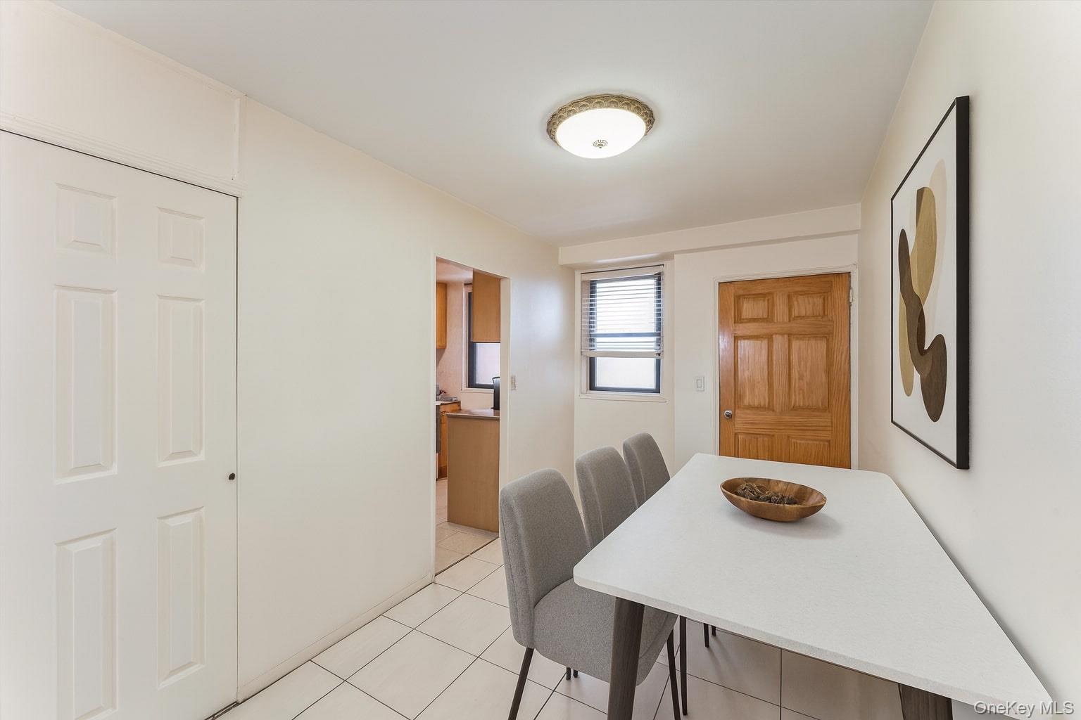 61-15 98th Street, Unit I6 H Queens, NY 11374 - Photo 12 of 25 a view of a dining room with furniture and window