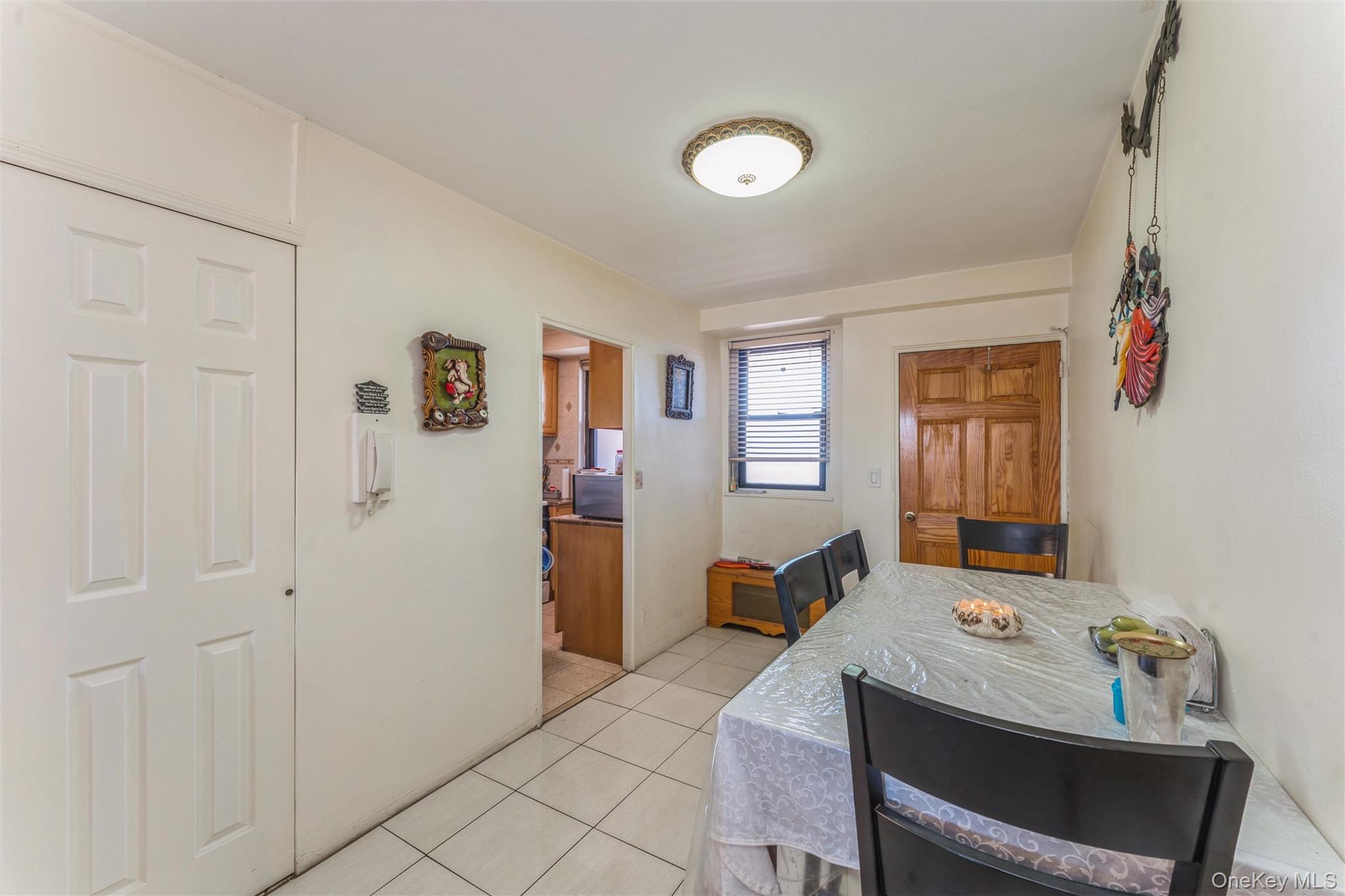 61-15 98th Street, Unit I6 H Queens, NY 11374 - Photo 13 of 25 a view of a livingroom with furniture and windows