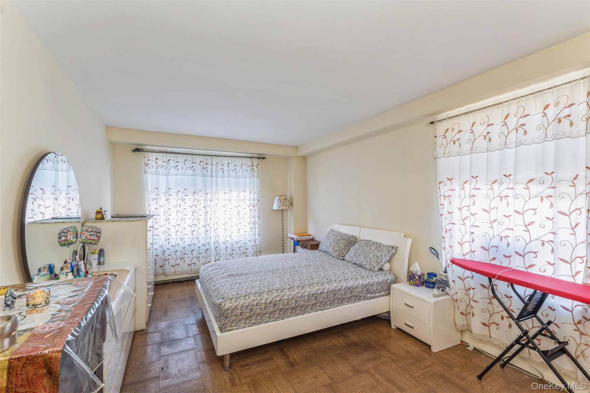 61-15 98th Street, Unit I6 H Queens, NY 11374 - Photo 7 of 25 a bedroom with a bed and window