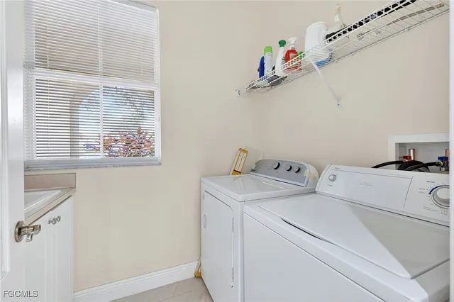 a view of storage and utility room with washer and dryer