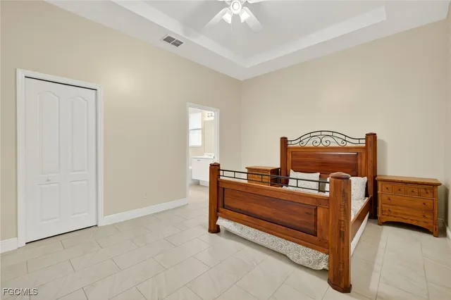 a bedroom with furniture and a chandelier