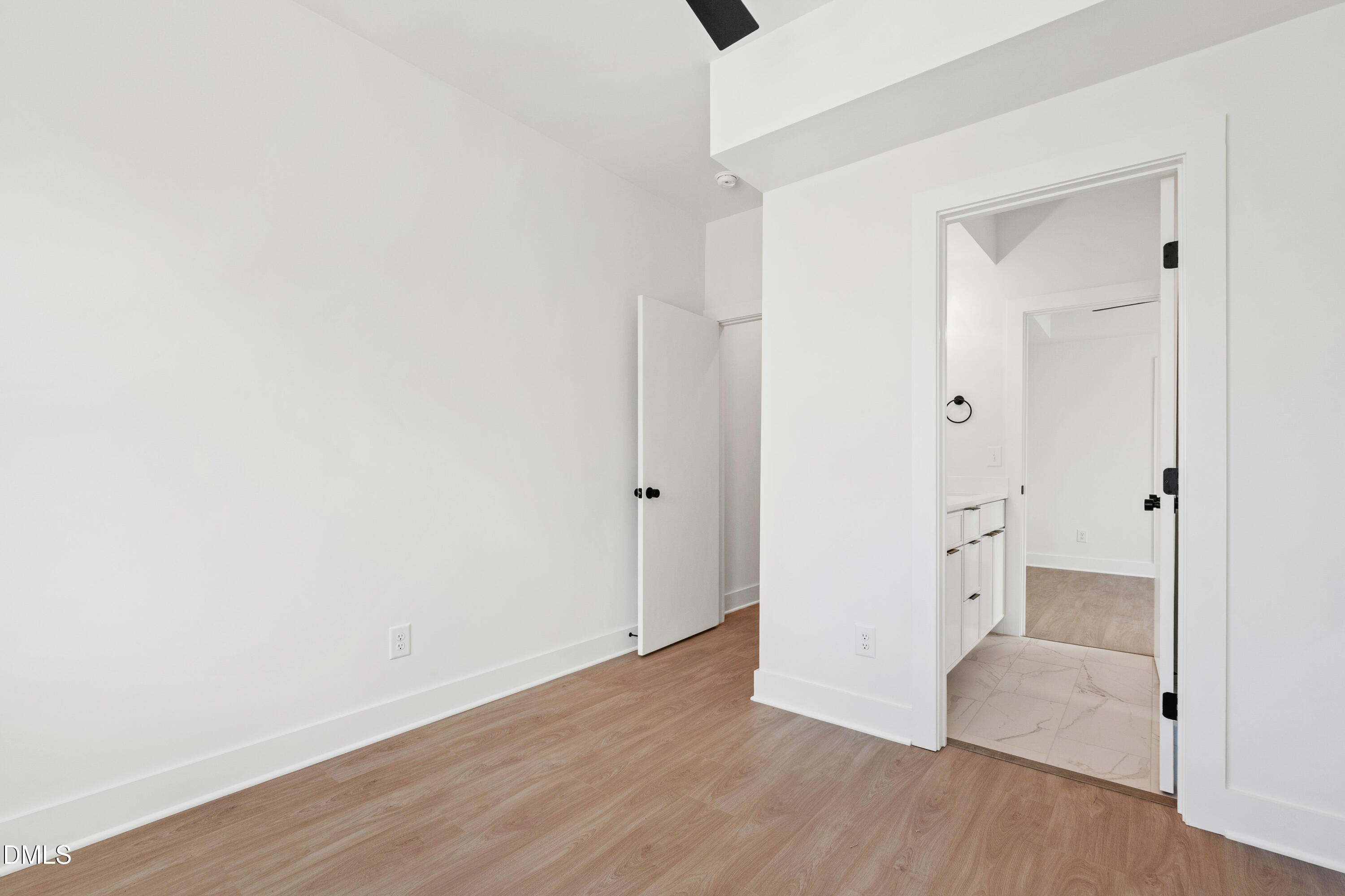 1510 Boyer Street Raleigh, NC 27610 - Photo 32 of 52 a view of an empty room with wooden floor