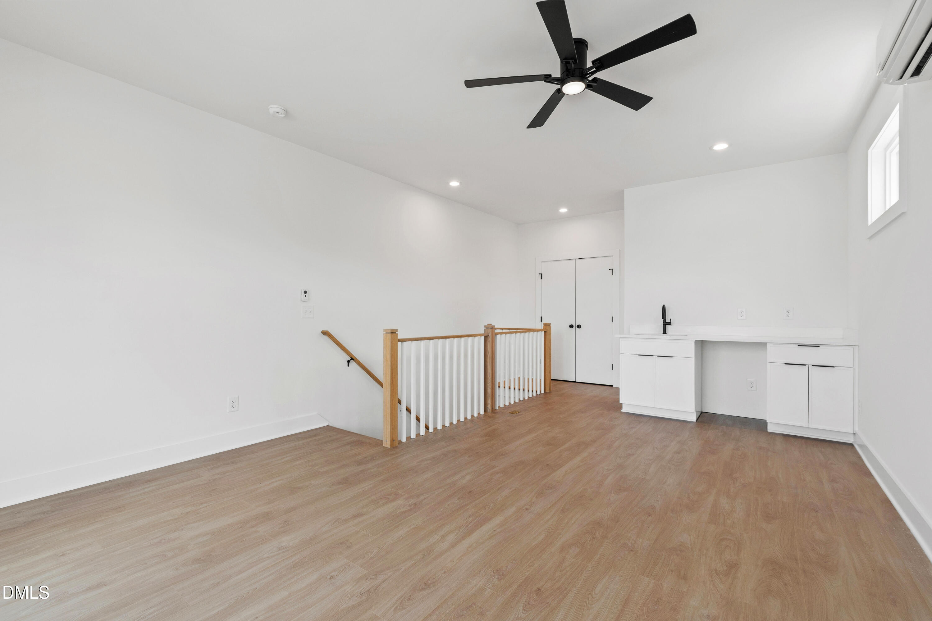 1510 Boyer Street Raleigh, NC 27610 - Photo 42 of 52 wooden floor in an empty room with a ceiling fan