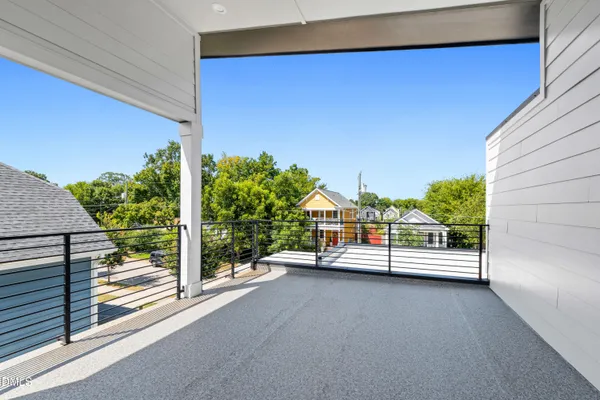 a view of a backyard with a fence