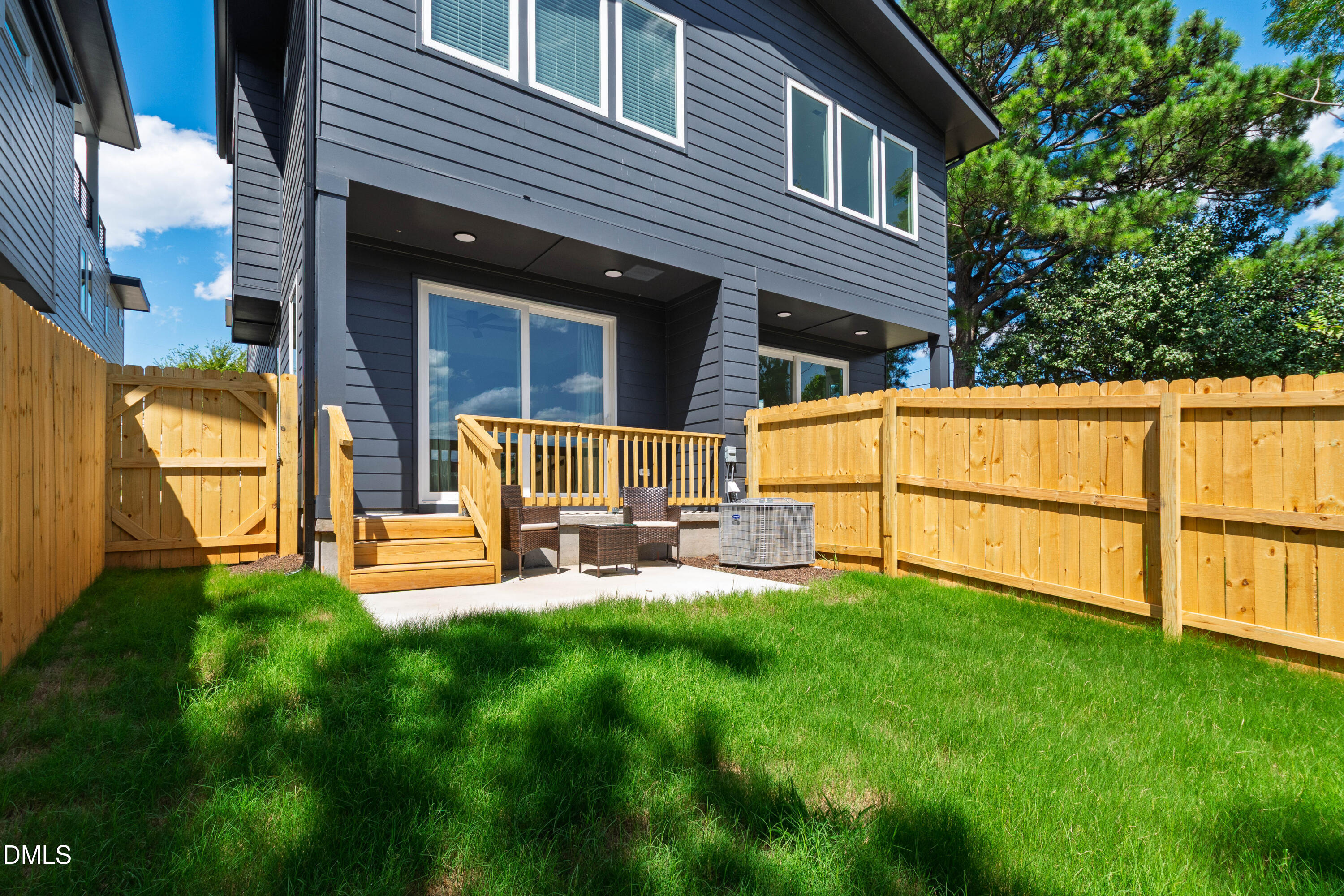 1510 Boyer Street Raleigh, NC 27610 - Photo 52 of 52 a backyard of a house with table and chairs