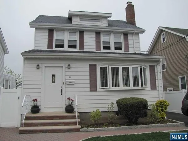 front view of a house with a small yard