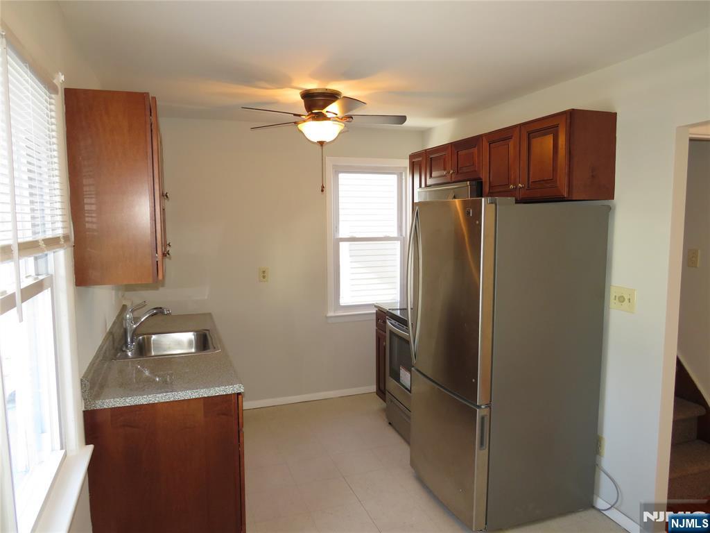 11 Louis Street, Unit 2 Lodi, NJ 07644 - Photo 11 of 19 a kitchen with a refrigerator and a sink