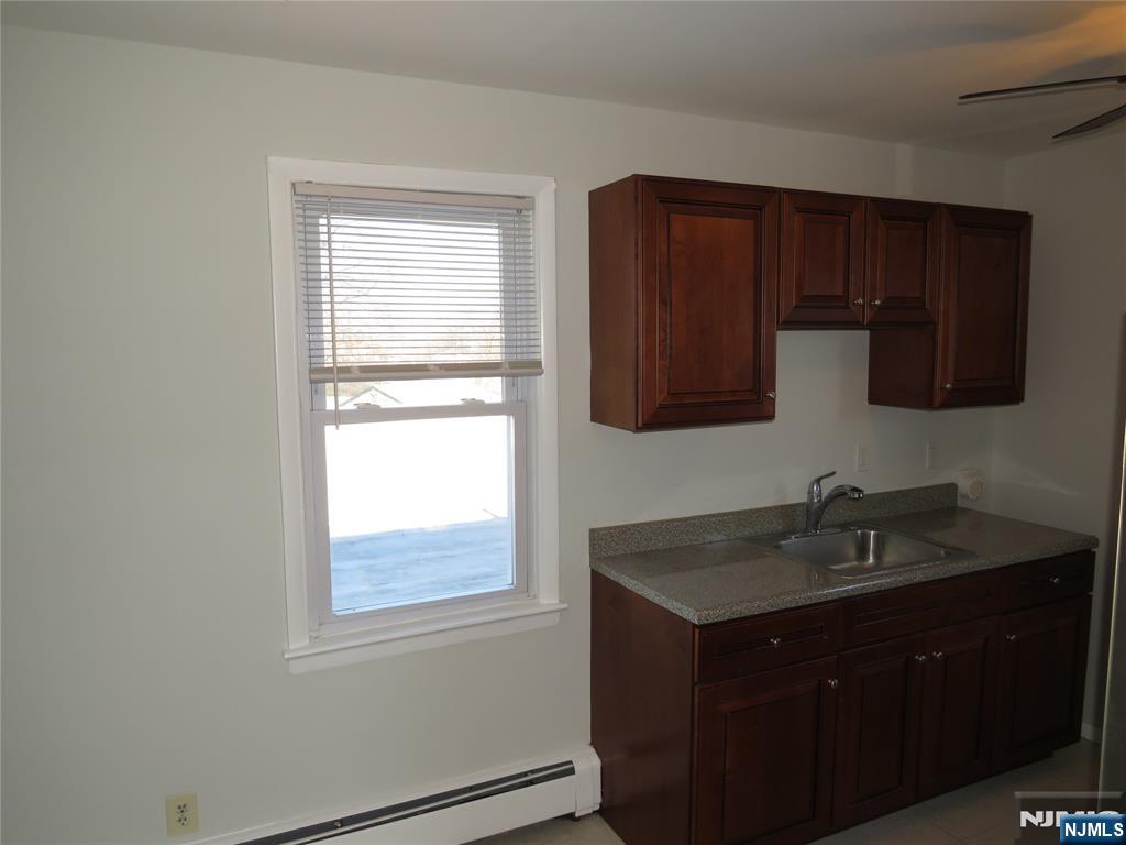 11 Louis Street, Unit 2 Lodi, NJ 07644 - Photo 14 of 19 a kitchen with a sink and a window