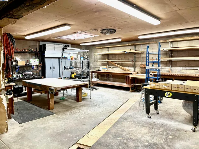 a view of a kitchen with a sink and dishwasher next to a window