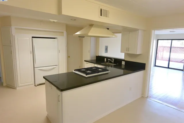 a view of hallway with washer and dryer