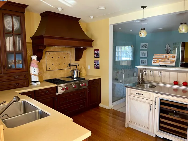 a kitchen with a stove and a sink