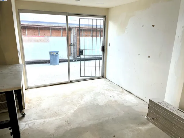 a living room with furniture a table and chairs