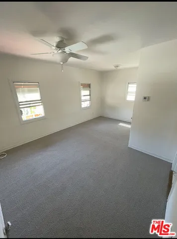 a view of an empty room and a windows