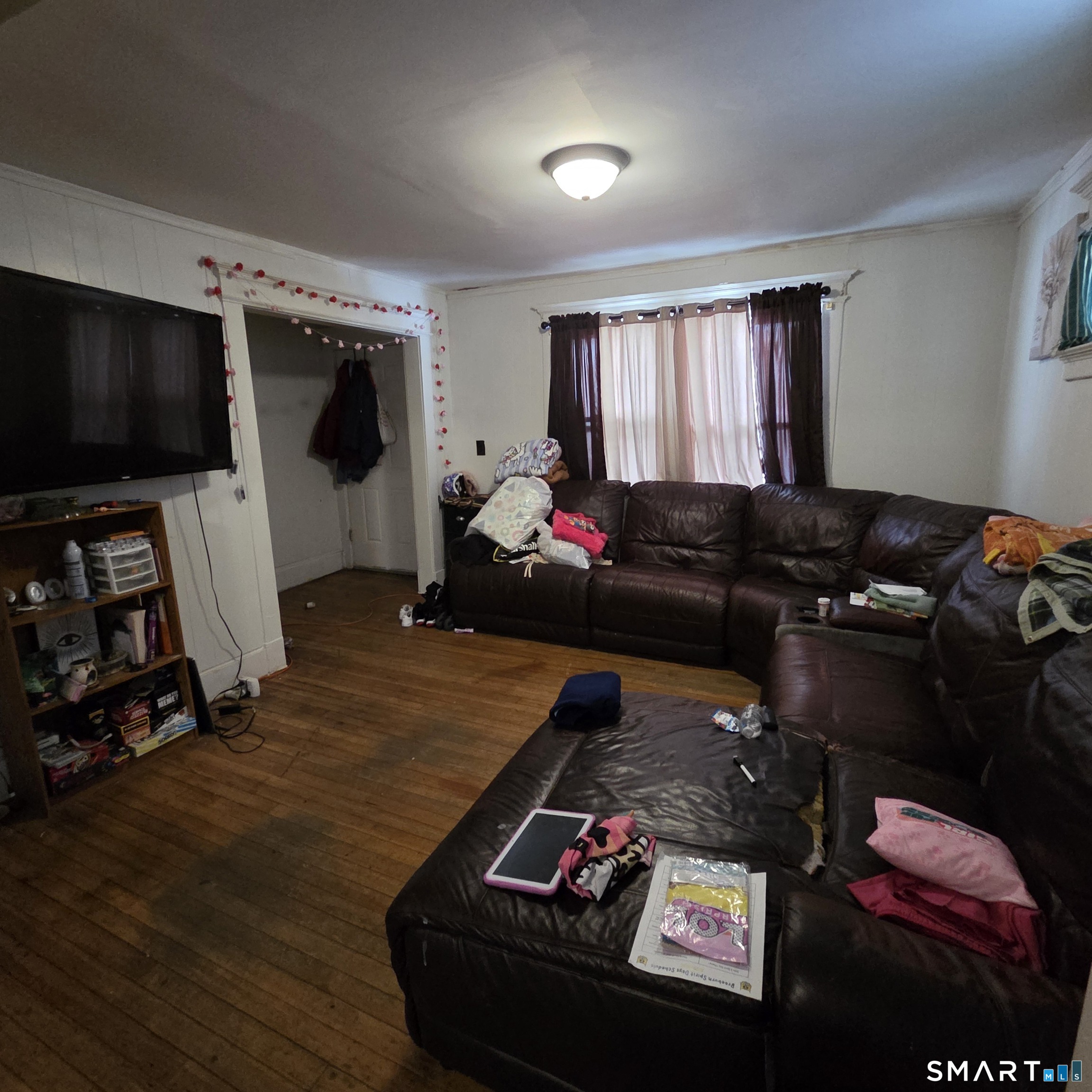 18 Darby Street Bloomfield, CT 06002 - Photo 11 of 33 a living room with furniture and a flat screen tv