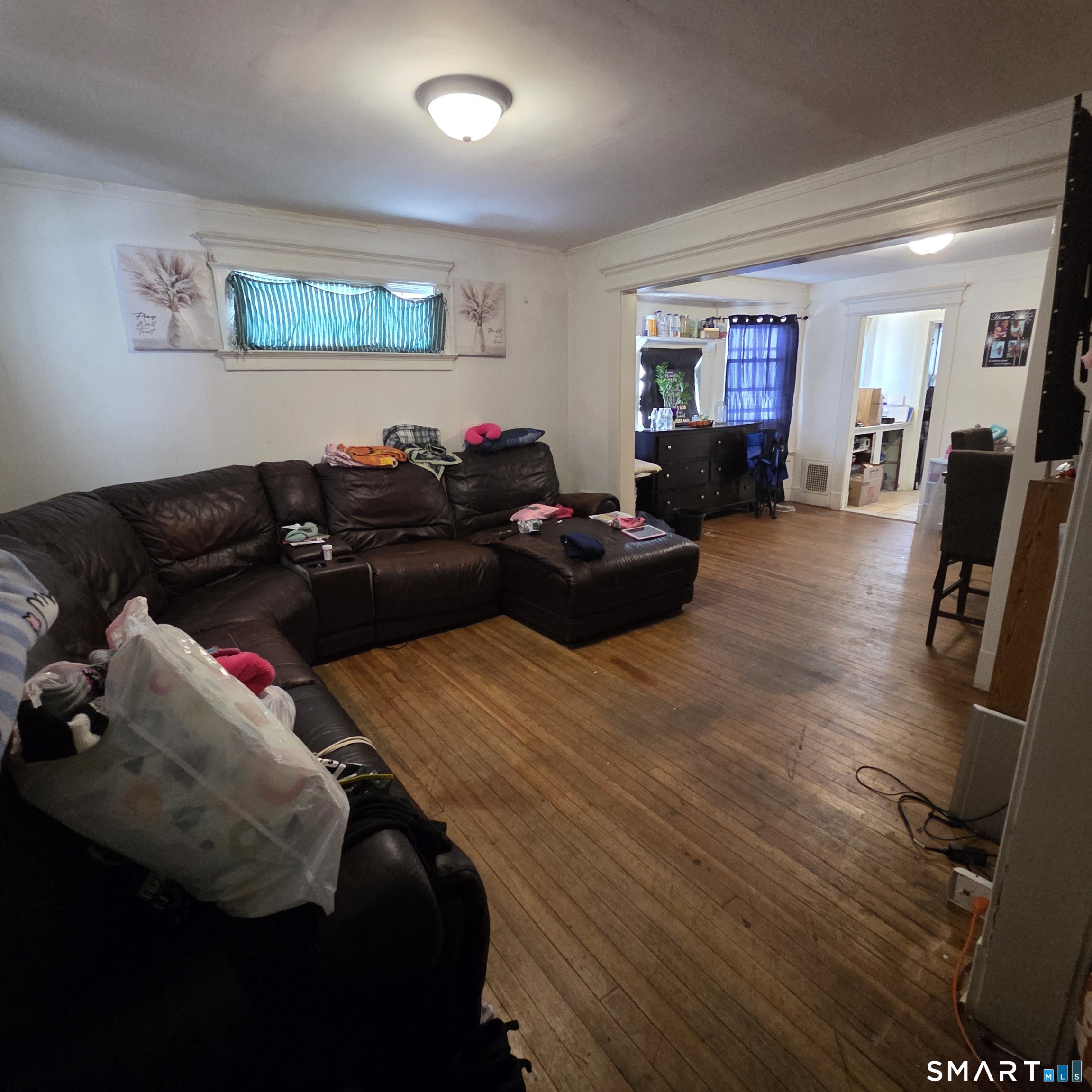 18 Darby Street Bloomfield, CT 06002 - Photo 12 of 33 a living room with furniture and a flat screen tv