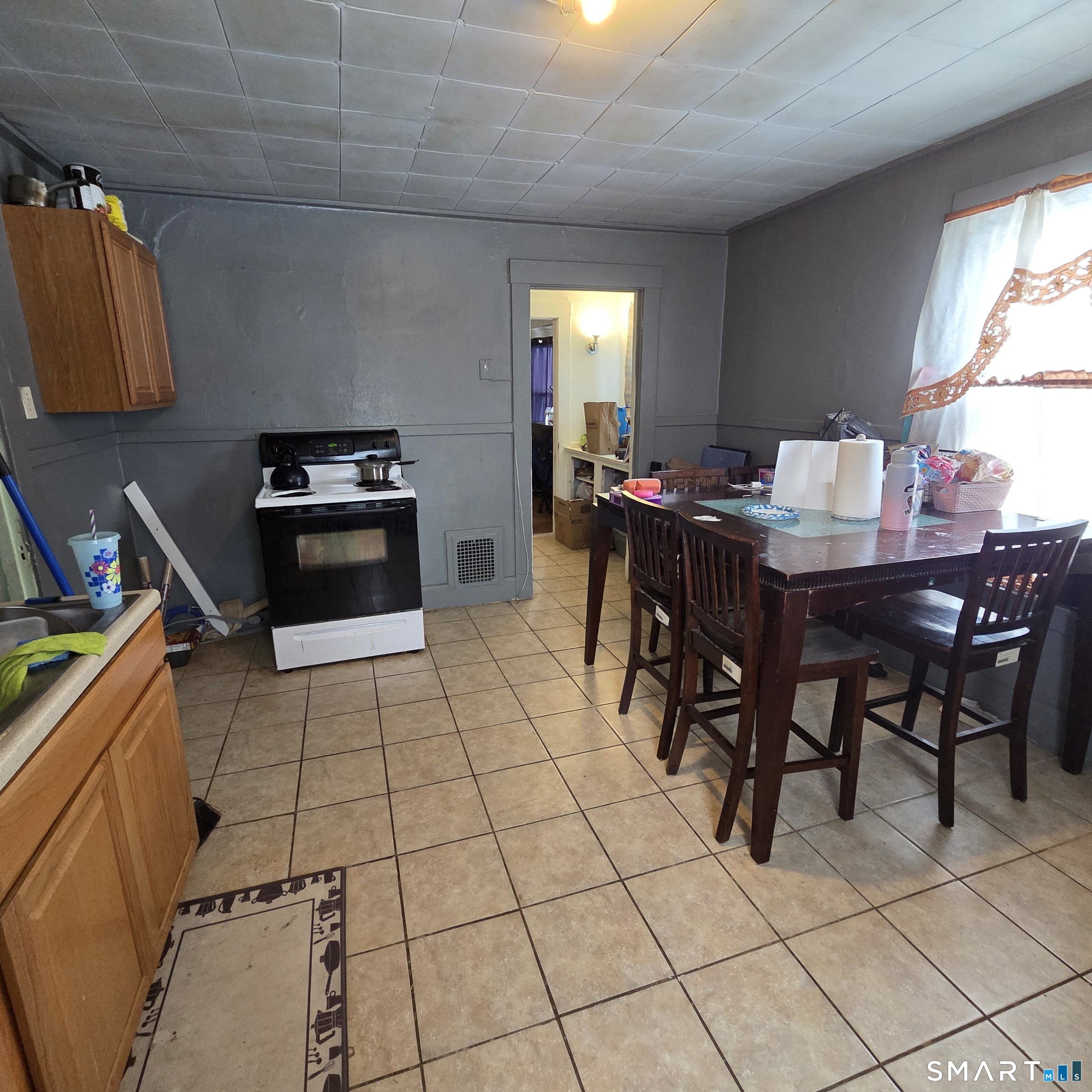 18 Darby Street Bloomfield, CT 06002 - Photo 15 of 33 a kitchen with a sink a stove and a refrigerator