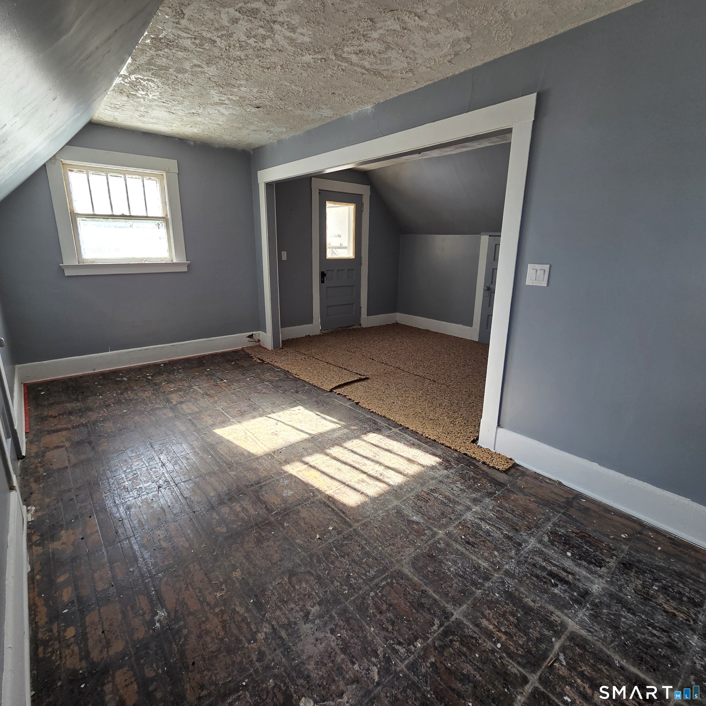 18 Darby Street Bloomfield, CT 06002 - Photo 21 of 33 a view of empty room with wooden floor and fan