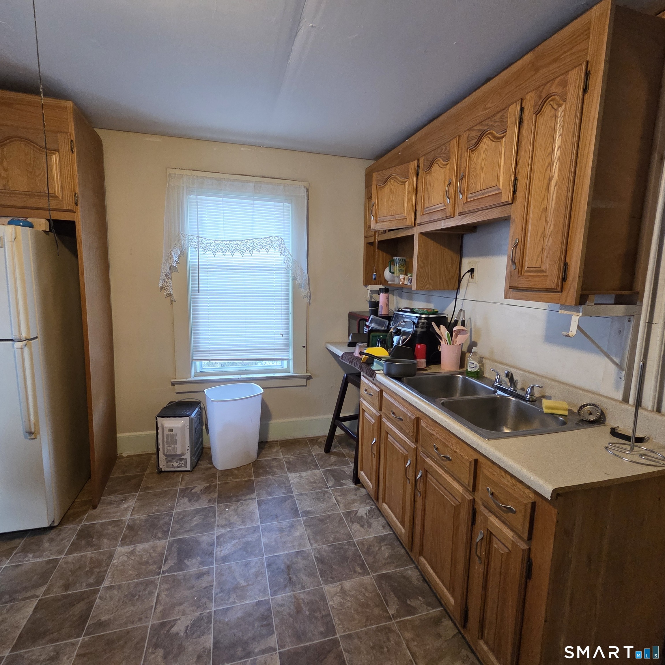 18 Darby Street Bloomfield, CT 06002 - Photo 5 of 33 a kitchen with a sink stove and cabinets
