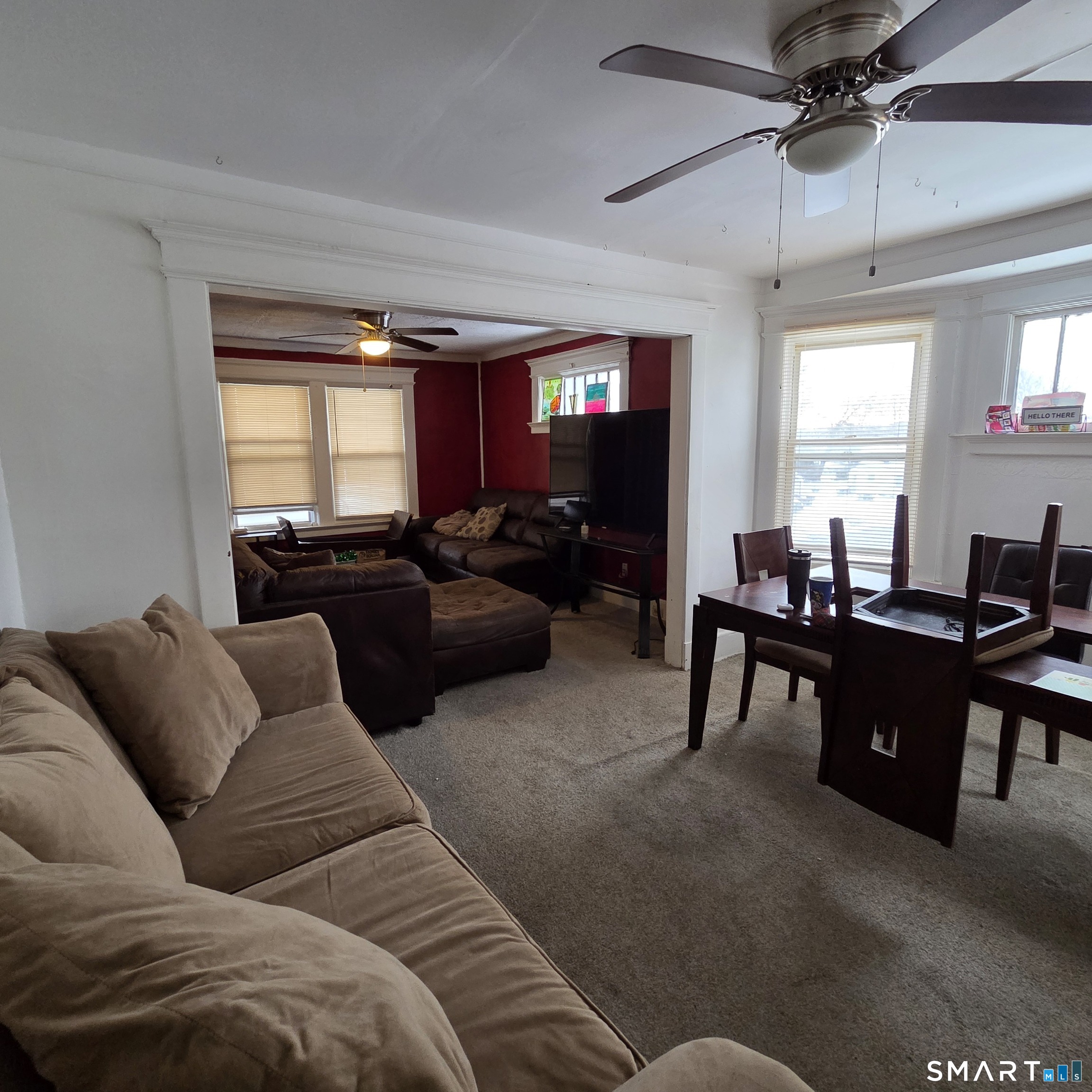 18 Darby Street Bloomfield, CT 06002 - Photo 6 of 33 a living room with furniture ceiling fan and a window