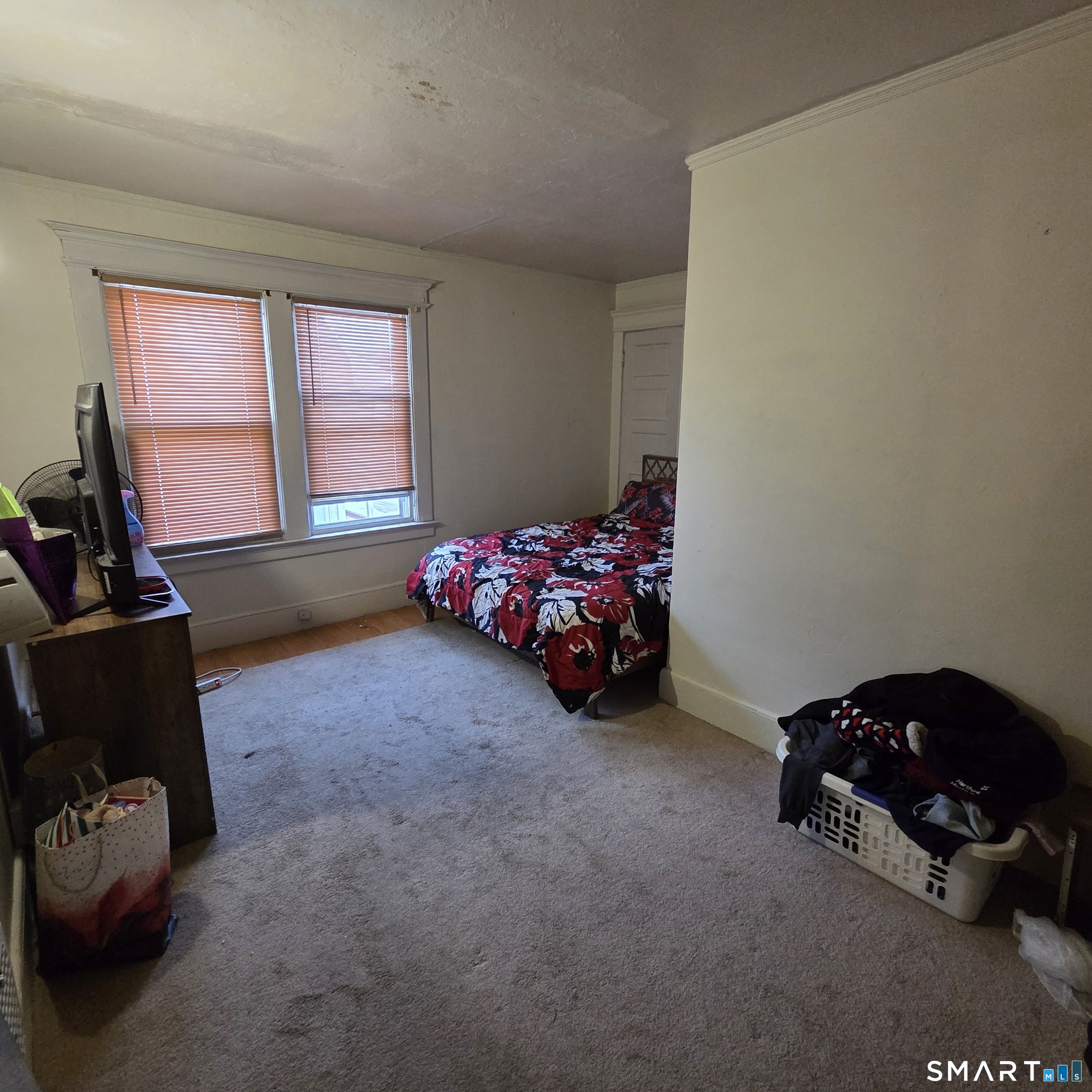 18 Darby Street Bloomfield, CT 06002 - Photo 8 of 33 a bed sitting in a room next to a window