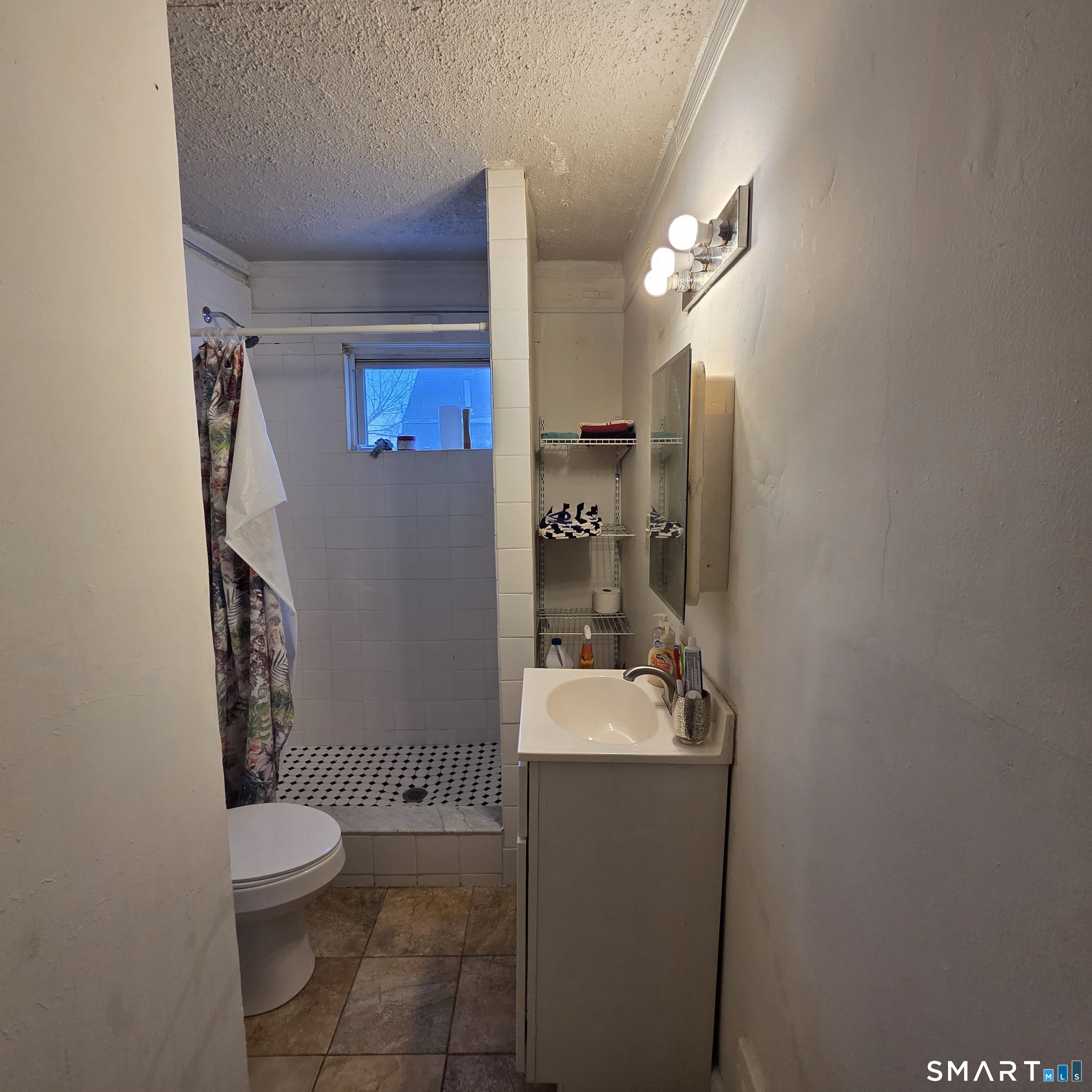 18 Darby Street Bloomfield, CT 06002 - Photo 9 of 33 a bathroom with a toilet a sink and mirror