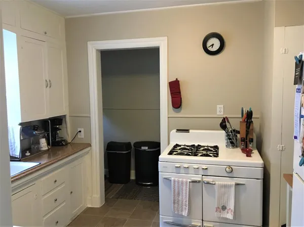 a kitchen with a stove and a refrigerator