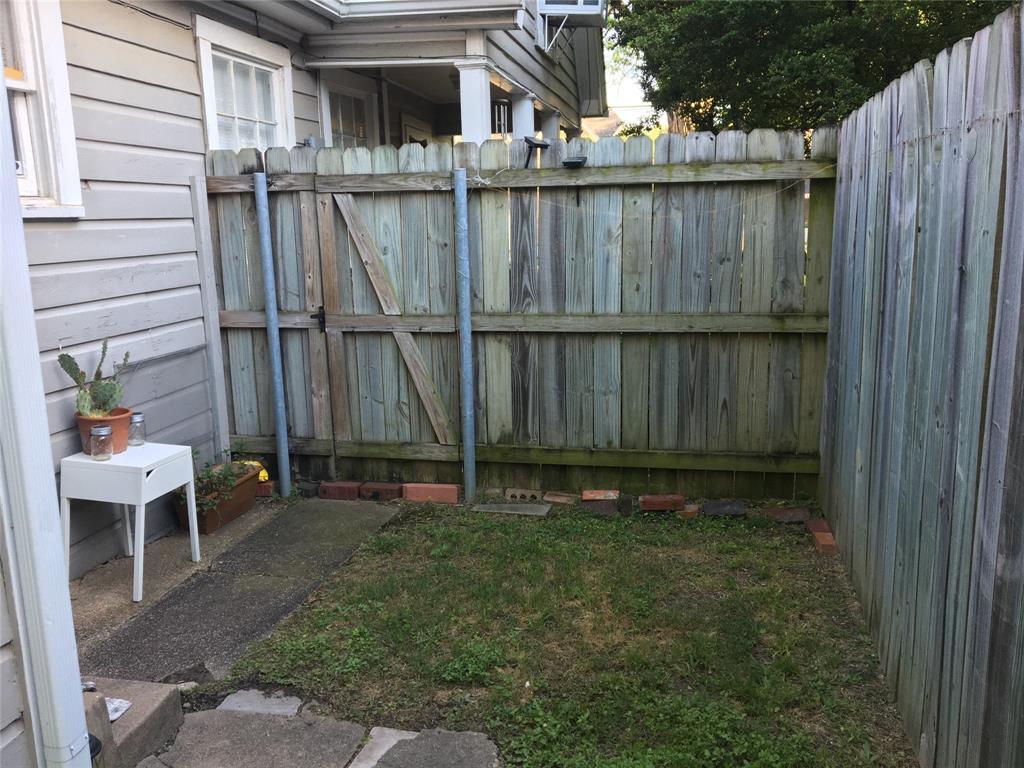 5949 Lewis Street Dallas, TX 75206 - Photo 9 of 10 a view of a backyard with a chair and potted plants