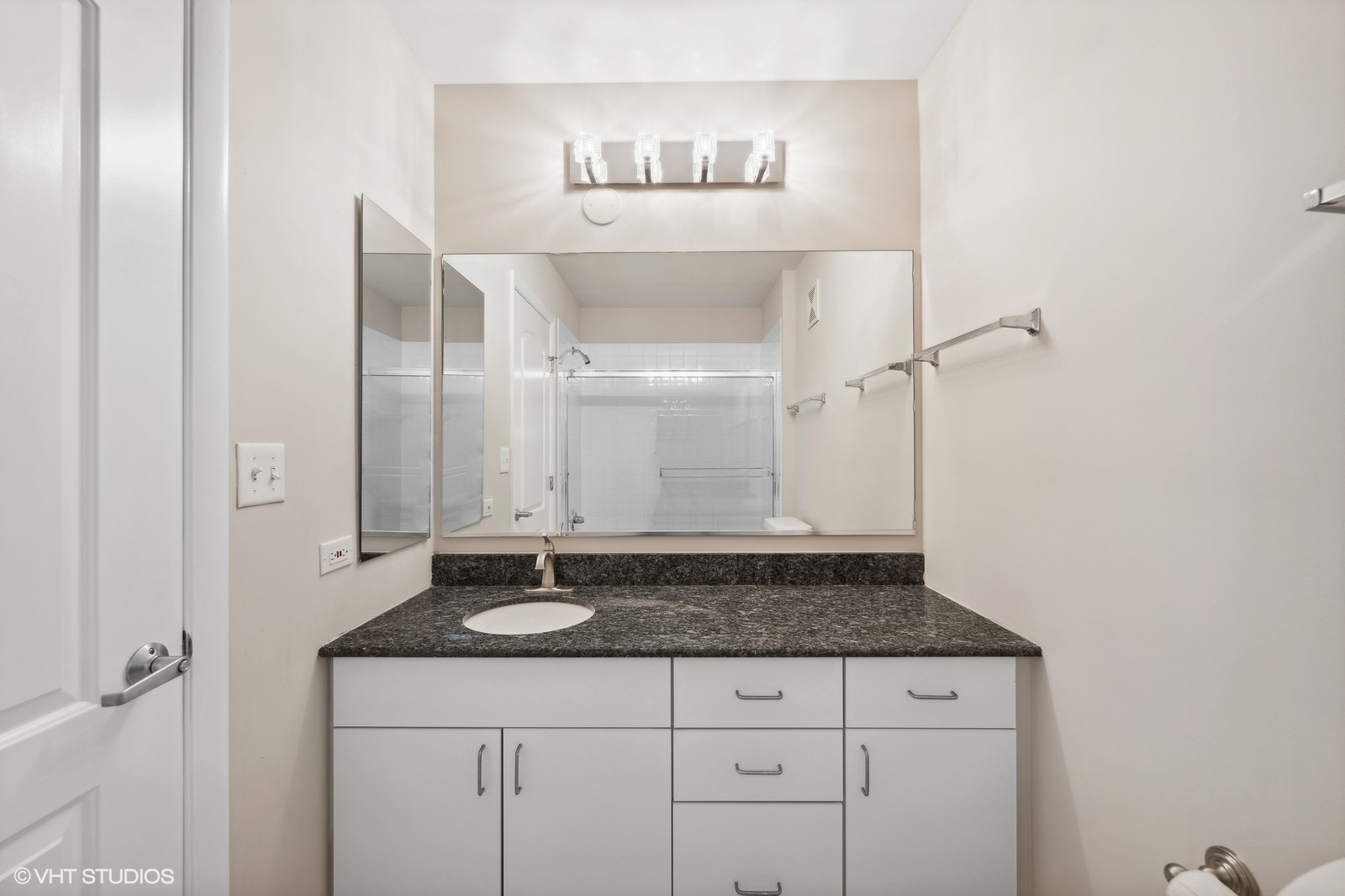 388 Milford Road Deerfield, IL 60015 - Photo 23 of 37 a bathroom with a granite countertop sink and a mirror