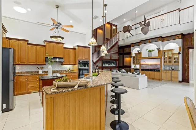 a bathroom with a granite countertop sink mirror bathtub and shower