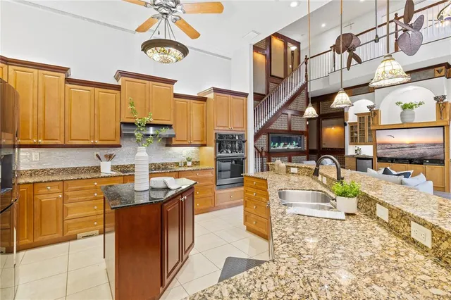 a spacious bathroom with a granite countertop sink mirror and toilet