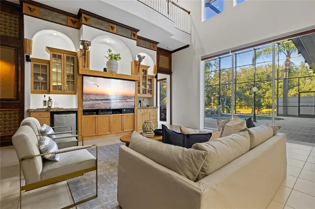 a view of a dining room with furniture and window