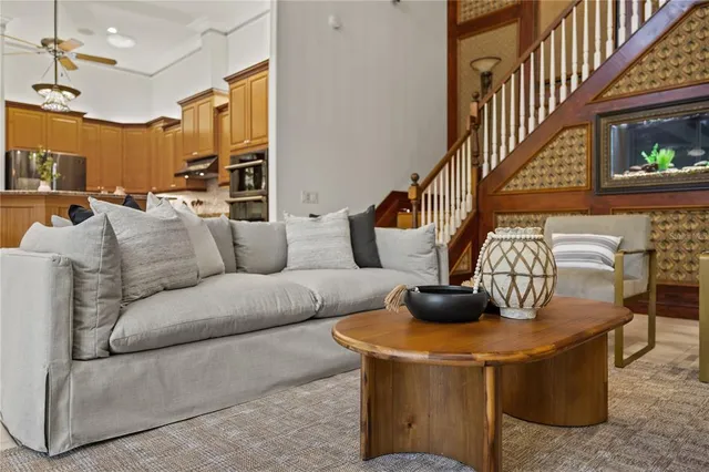 a view of a livingroom with furniture wooden floor and window