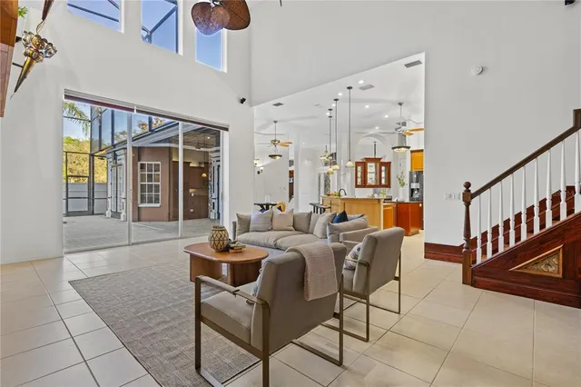 a view of a kitchen with granite countertop cabinets and a view of living room