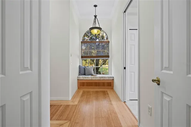 a kitchen with stainless steel appliances kitchen island granite countertop a stove refrigerator and cabinets