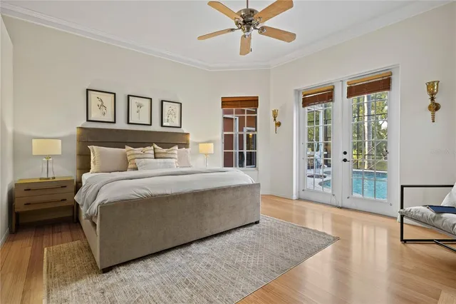 a kitchen with stainless steel appliances kitchen island granite countertop a refrigerator a stove and a sink with cabinets