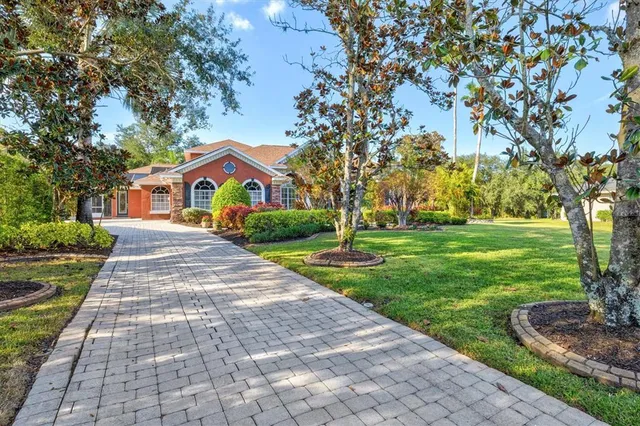 a view of a livingroom with furniture and front view of a house