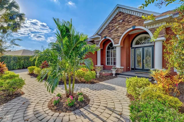 a kitchen with stainless steel appliances granite countertop a sink and cabinets
