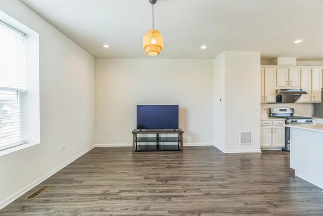 a view of kitchen with microwave and cabinets