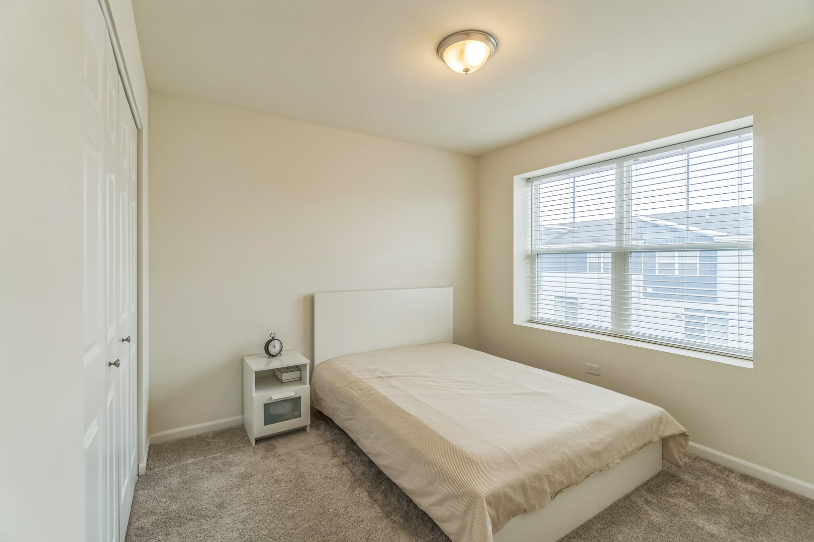 4138 Irving Road Aurora, IL 60504 - Photo 16 of 32 a bedroom with a bed and a window