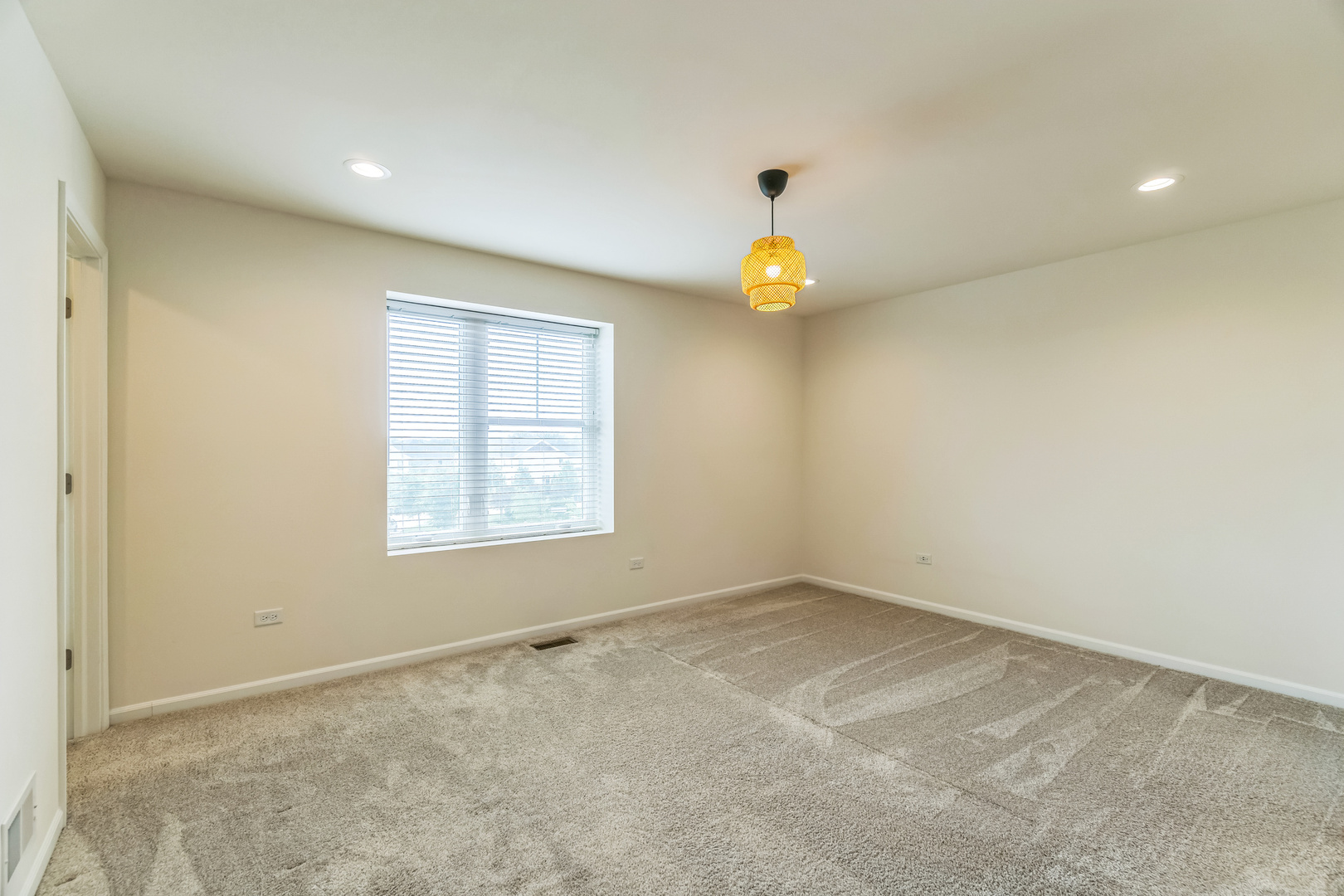 4138 Irving Road Aurora, IL 60504 - Photo 5 of 32 an empty room with window