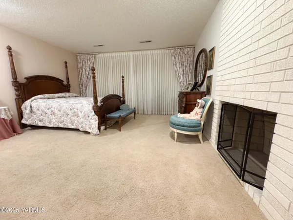 a bedroom with bed and window