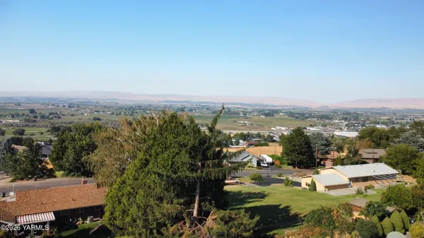 an aerial view of a house with a garden