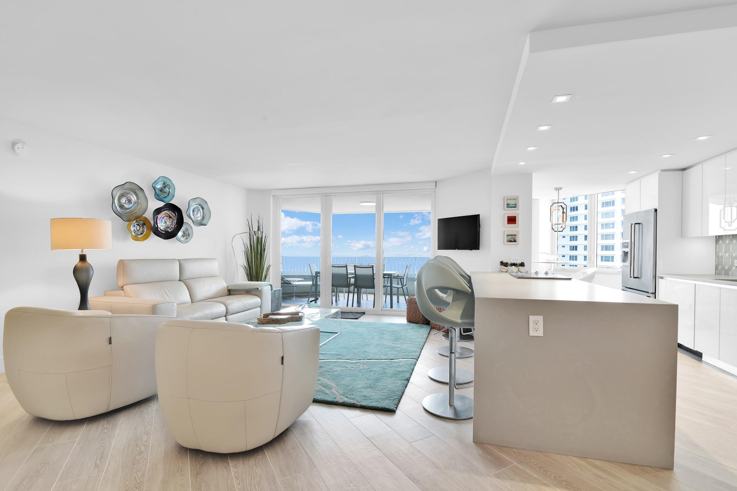 550 South Ocean Boulevard, Unit 1004 Boca Raton, FL 33432 - Photo 1 of 74 a living room with furniture and wooden floor