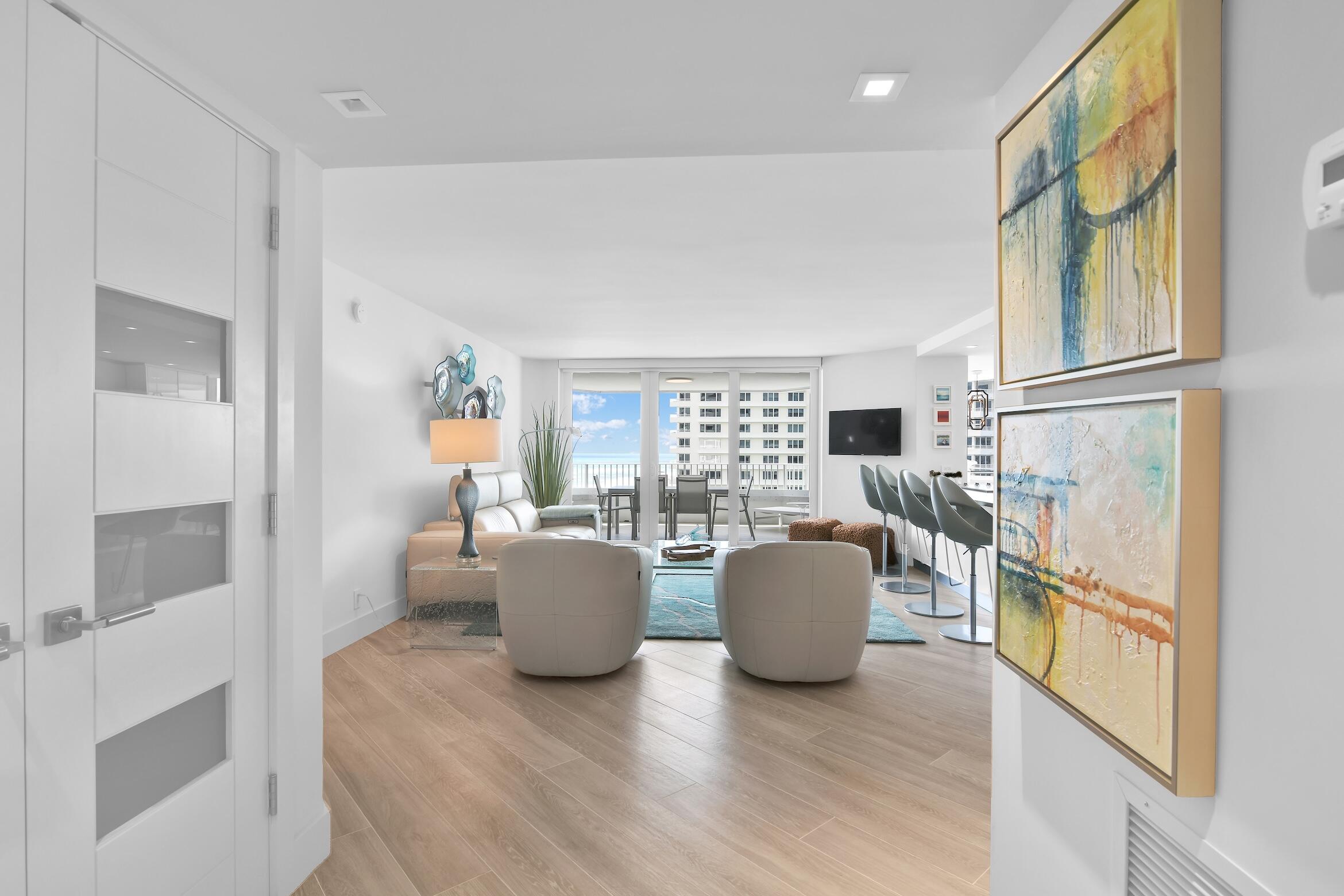 550 South Ocean Boulevard, Unit 1004 Boca Raton, FL 33432 - Photo 31 of 74 a living room with furniture and a large window